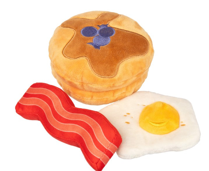 Plush toy resembling a pancake, bacon, and egg on a white background
