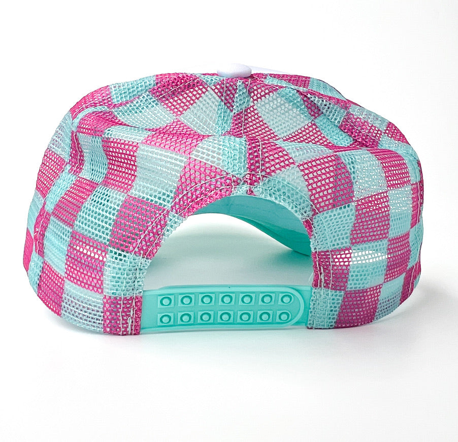 A mesh-back baseball cap shown from the back, featuring a pink and light blue checkerboard pattern on the crown and a matching light blue adjustable snap closure.
