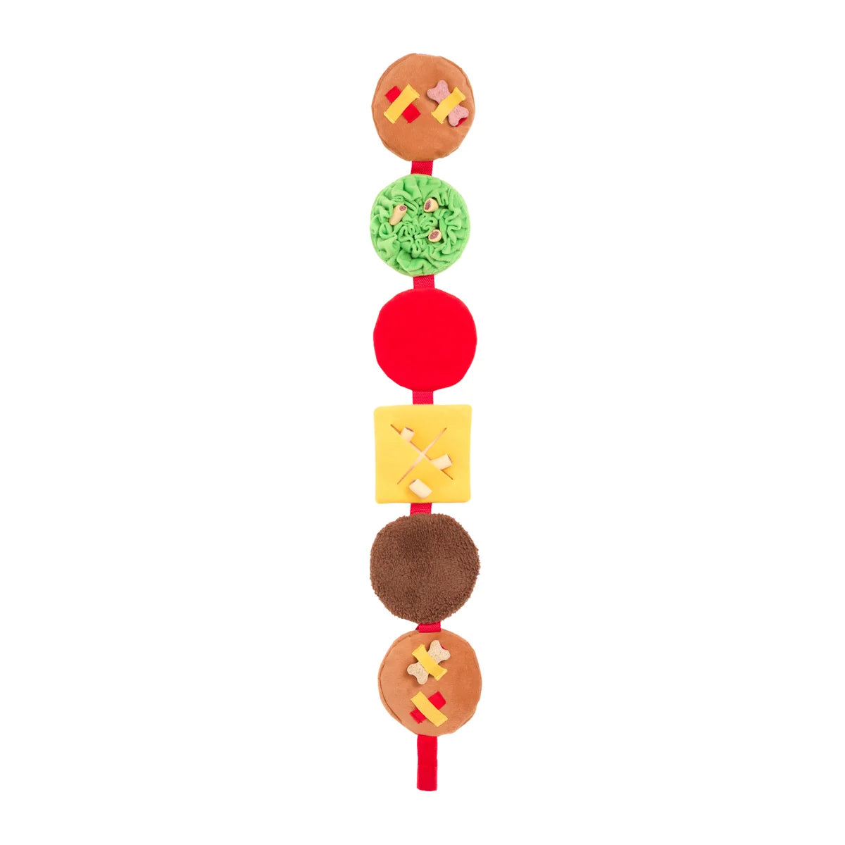 Colorful dog toy with various layers on a white background. Layers include lettuce, tomatoes, cheese, meat, and buns